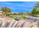 Inviting community park featuring picnic benches, lush green space, and palm trees at 1134 Pandora Canyon St, Henderson, NV 89052