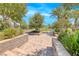 Picturesque community park featuring stone benches, mature trees, and lush landscaping at 1134 Pandora Canyon St, Henderson, NV 89052