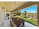 Extended covered patio with dining and seating areas overlooking the backyard at 1134 Pandora Canyon St, Henderson, NV 89052