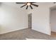 Bedroom with carpeted floors, ceiling fan and paneled door at 1209 S 17Th St, Las Vegas, NV 89104