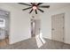 Bedroom featuring carpet, ceiling fan, ensuite bathroom, and closets at 1209 S 17Th St, Las Vegas, NV 89104