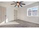 Bedroom featuring carpet, a window and paneled doors at 1209 S 17Th St, Las Vegas, NV 89104
