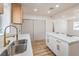 Modern kitchen showcasing island, quartz countertops and gold hardware at 1209 S 17Th St, Las Vegas, NV 89104