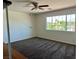 Large bedroom with a large window, neutral carpeting, and lots of natural light at 1921 Moonlight Bluff Ave, North Las Vegas, NV 89084