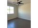 Cozy bedroom with neutral paint, tile flooring, and ample natural light at 1921 Moonlight Bluff Ave, North Las Vegas, NV 89084