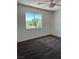Bedroom featuring neutral walls, carpeting and a large window at 1921 Moonlight Bluff Ave, North Las Vegas, NV 89084