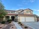 Charming two-story home featuring a two-car garage and well-maintained landscaping at 1921 Moonlight Bluff Ave, North Las Vegas, NV 89084