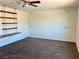 Large empty room with a desk and a window at 1921 Moonlight Bluff Ave, North Las Vegas, NV 89084