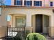 Charming front porch with desert landscaping, stucco columns, and a dark front door at 1921 Moonlight Bluff Ave, North Las Vegas, NV 89084