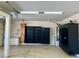 Garage includes cabinets and shelves for storage at 1921 Moonlight Bluff Ave, North Las Vegas, NV 89084