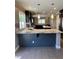 Spacious kitchen with dark cabinets, granite countertops, and stainless steel appliances at 1921 Moonlight Bluff Ave, North Las Vegas, NV 89084