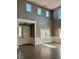 Bright living room featuring high ceilings, neutral tones and large windows at 1921 Moonlight Bluff Ave, North Las Vegas, NV 89084