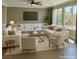 Bright living room with large windows, neutral tones and an open layout at 1921 Moonlight Bluff Ave, North Las Vegas, NV 89084