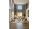 Bright living room with high ceilings, neutral tones and an open layout at 1921 Moonlight Bluff Ave, North Las Vegas, NV 89084