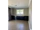 Open living room with hardwood floors, built in cabinets, and plenty of natural light at 1921 Moonlight Bluff Ave, North Las Vegas, NV 89084