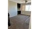 Spacious loft area with plush carpeting and a built-in desk, perfect for a home office at 1921 Moonlight Bluff Ave, North Las Vegas, NV 89084