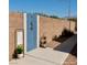 Modern outdoor shower featuring blue tile accents and convenient towel rack on a concrete patio at 1921 Moonlight Bluff Ave, North Las Vegas, NV 89084