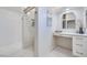 Bathroom featuring dual vanities and a tiled walk-in shower at 1953 Moyer Dr, Henderson, NV 89074