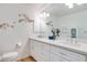 Elegant bathroom with double sinks, modern fixtures, and a decorative bird mural at 1953 Moyer Dr, Henderson, NV 89074