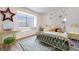 Stylishly staged bedroom featuring a decorative wall, window seat and modern decor elements at 1953 Moyer Dr, Henderson, NV 89074