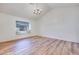Spacious bedroom featuring a window seat and laminate wood flooring at 1953 Moyer Dr, Henderson, NV 89074