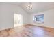 Bedroom with laminate wood flooring and an open door to the bathroom at 1953 Moyer Dr, Henderson, NV 89074
