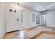 Bright foyer featuring wood floors, a white front door, and charming windows for natural light at 1953 Moyer Dr, Henderson, NV 89074