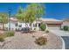 Charming single-story home featuring a well-manicured front yard and attached two-car garage at 1953 Moyer Dr, Henderson, NV 89074