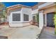 Inviting front patio with stylish seating, a round table, and decorative plants, perfect for relaxing outdoors at 1953 Moyer Dr, Henderson, NV 89074