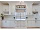 Elegant kitchen with custom white cabinets, countertop, and stylish decor at 1953 Moyer Dr, Henderson, NV 89074