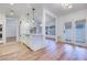 Open-concept kitchen area with island, white cabinets, and stainless appliances at 1953 Moyer Dr, Henderson, NV 89074