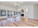 Open-concept living room featuring wood floors, fireplace, and large windows, perfect for entertaining at 1953 Moyer Dr, Henderson, NV 89074