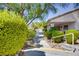 Beautiful walkway with lush landscaping and nearby clubhouse access at 1953 Moyer Dr, Henderson, NV 89074