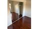 Bright bedroom featuring mirrored closet doors and hardwood flooring at 2212 Sunfish Dr # D, Henderson, NV 89014