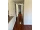 Hallway features wood floors and neutral paint connecting the rooms of the home at 2212 Sunfish Dr # D, Henderson, NV 89014