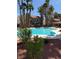 Community pool with mature landscaping and surrounding condo buildings at 2212 Sunfish Dr # D, Henderson, NV 89014
