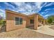 The home has a covered patio, low water landscaping, and sunny exposure at 2365 Wisconsin Dells Dr, Henderson, NV 89044