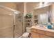 Inviting bathroom featuring glass shower doors and a well-lit vanity at 2365 Wisconsin Dells Dr, Henderson, NV 89044