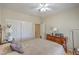 Comfortable bedroom features a ceiling fan, a closet, and wood flooring at 2365 Wisconsin Dells Dr, Henderson, NV 89044
