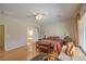Spacious bedroom with hardwood floors, a ceiling fan and an attached bathroom with a separate shower and tub at 2365 Wisconsin Dells Dr, Henderson, NV 89044