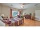 Sunny bedroom with hardwood floors, a large window, and a traditional-style furniture set at 2365 Wisconsin Dells Dr, Henderson, NV 89044