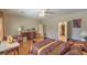 Large bedroom with hardwood floors, a ceiling fan, and a walk-in closet, offering ample storage at 2365 Wisconsin Dells Dr, Henderson, NV 89044