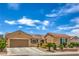 Charming single-story home boasts a well-manicured yard and a two-car garage at 2365 Wisconsin Dells Dr, Henderson, NV 89044