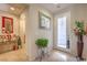 Welcoming foyer with tiled floor, an ornate table, and bright, natural light at 2365 Wisconsin Dells Dr, Henderson, NV 89044