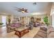 Open-concept living and dining area with tiled flooring, plenty of seating, and lots of natural light at 2365 Wisconsin Dells Dr, Henderson, NV 89044
