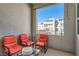 Outdoor balcony space featuring comfortable seating and views of the surrounding neighborhood at 2507 Silent View Ave, Henderson, NV 89044