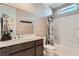 Bright bathroom with a large mirror, shower/tub combo, and modern fixtures at 2507 Silent View Ave, Henderson, NV 89044