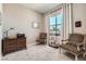 Bedroom with desk, chairs, and large window offering plenty of light at 2507 Silent View Ave, Henderson, NV 89044