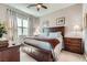 A well-appointed bedroom with natural light, a ceiling fan, and neutral decor at 2507 Silent View Ave, Henderson, NV 89044