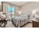 Cozy bedroom featuring a large window, comfortable bed, and stylish nightstands at 2507 Silent View Ave, Henderson, NV 89044
